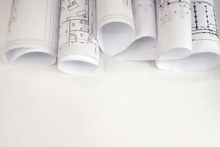 Scrolls of architectural drawings  The desk architect