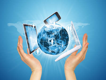 Hands holding a earth and electronics  Concept of communication  Elements of this image are...