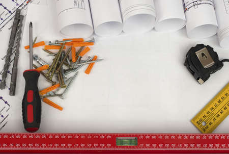 Scrolls of architectural drawings and tools  Desk builderの写真素材