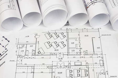 Scrolls of architectural drawings  The desk architect