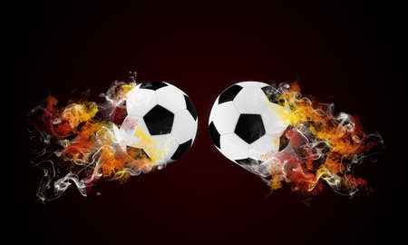 Two soccer ball in the color of flame and smoke  Sport conceptの写真素材