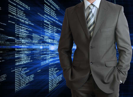 Businessman in a suit with background of glowing digital code  Business concept