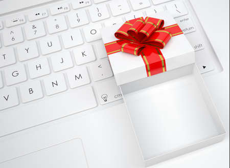 White open gift box lies on the keyboard  View from aboveの写真素材