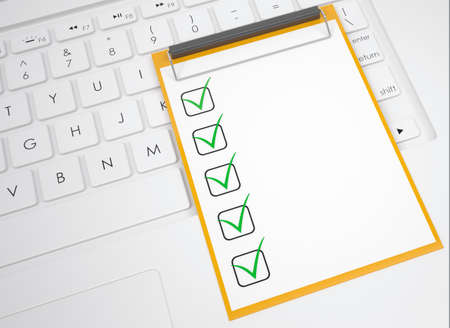 Checklist on the keyboard  View from aboveの写真素材