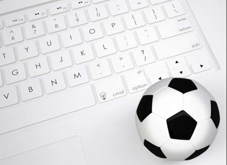 Soccer ball on the keyboard  View from aboveの写真素材
