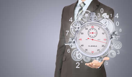 Businessman hold stopwatchの写真素材