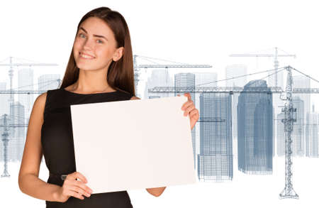 Businesswoman holding paper sheetの写真素材