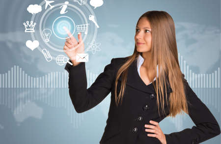 Beautiful businesswoman in suit finger presses virtual button