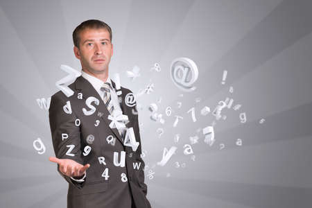 Businessman in suit hold empty hand with flying figuresの写真素材