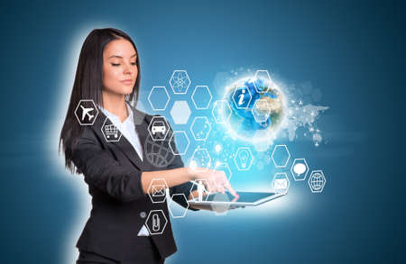 Women using digital tablet and Earth with hexagons