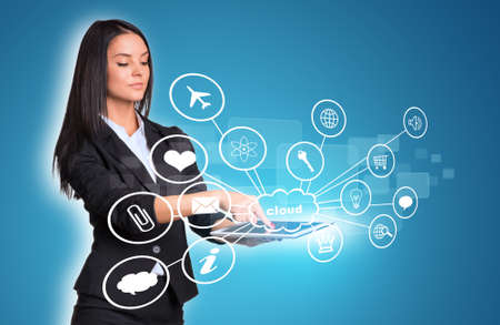 Women using digital tablet and cloud with iconsの写真素材