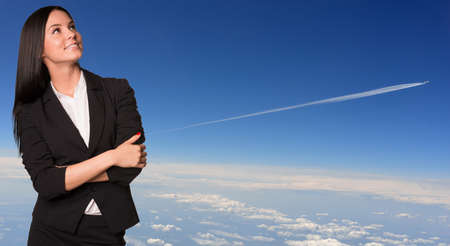 Businesswoman smiling and looking up