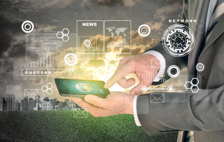 Man hands using smart phone. Earth on phone screen. City as backdrop. Element of this image...
