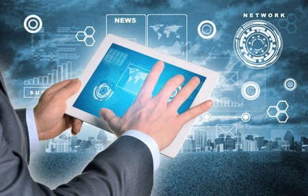 Man hands using tablet. Virtual elements on touchscreen. City as backdrop