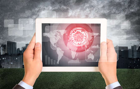 Man hands using tablet. Virtual elements on touchscreen. City as backdrop
