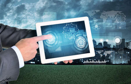 Man hands using tablet. Virtual elements on touchscreen. City as backdrop