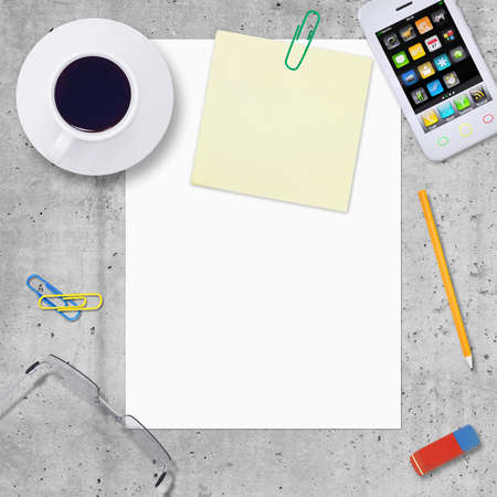 Blank paper with office and business work elements around, on smooth stone surface, top viewの写真素材