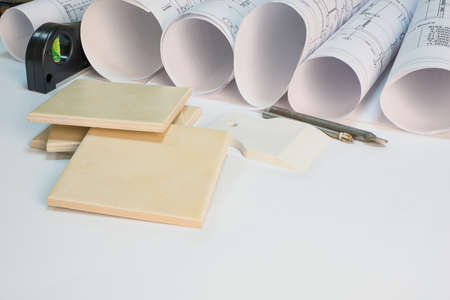 Drawing rolls, builder\'s level, tceramic tiles, tile drill bits, filling knifeの写真素材