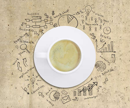 Business strategy infographics option drawn around coffee cup, on smooth stone surface, top viewの写真素材