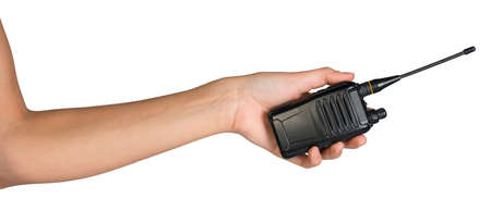 Female hand, bare, holding portable radio transmitter, isolated over white backgroundの写真素材