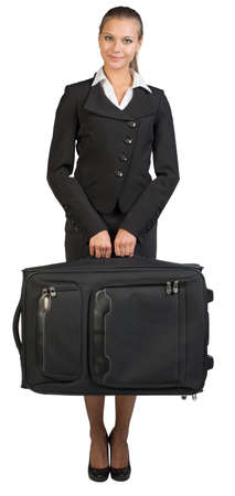 Businesswoman holding suitcase, looking at camera, smiling. Isolated over white backgroundの写真素材