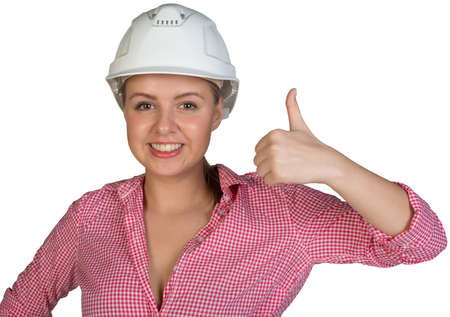 Woman in hard hat showing thumb-up, looking at camera, smiling. Isolated on white backgroundの写真素材