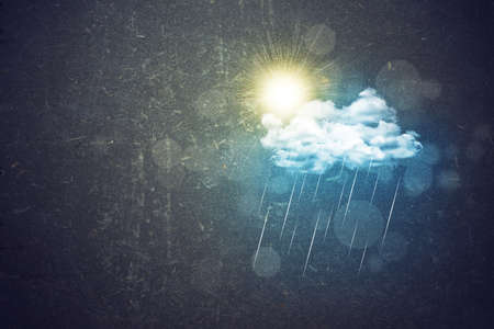 Cloud with rain and sun. Abstract concrete wall backgroundの写真素材