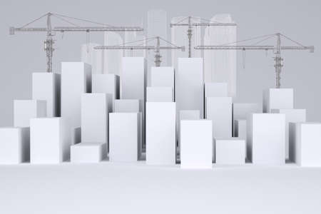 Many white cubes with wire-frame buildings and tower cranes on gray background. Concept of urban constructionの写真素材