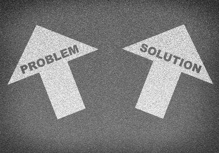 Asphalt road texture with two arrows. Labels problem and solution. Business conceptの写真素材