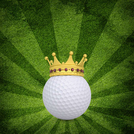 Golf ball with crown on green grass backgroundの写真素材