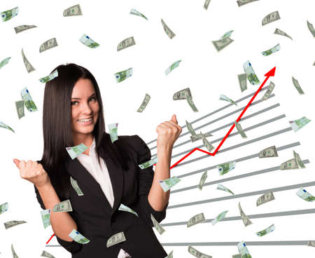 Businesswoman and graphical chart under money rain on isolated white backgroundの写真素材