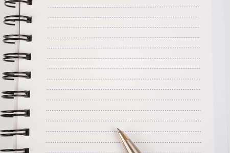 White ring-bound notebook with pen, close-up viewの写真素材