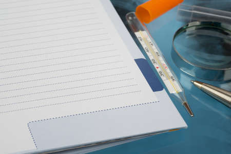 X-ray examination and loupe with notebook, close-up view