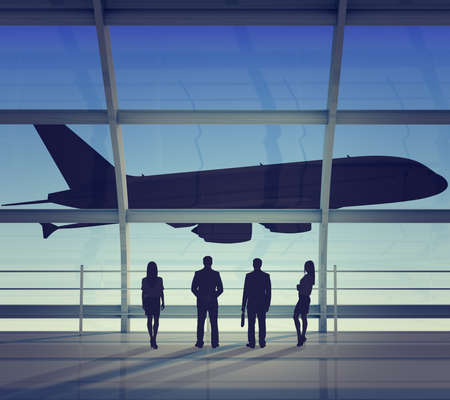 Businesspeople looking at jet, back view. Interior viewの写真素材