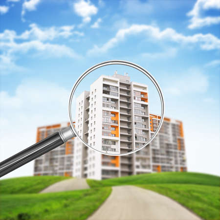 Buildings under loupe on nature landscape backgroundの写真素材