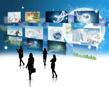 Businesswomen silhouettes with holographic screens background and pictures