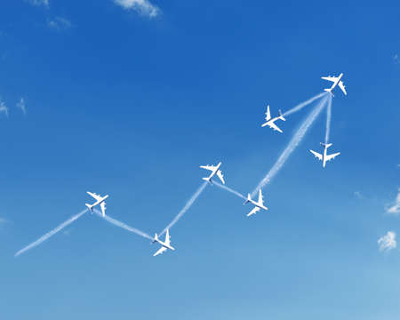 Growth arrow shape clouds with jets in blue skyの写真素材