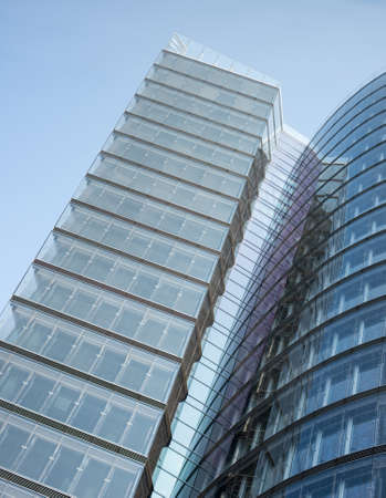 Skyscraper on blue sky background, bottom view
