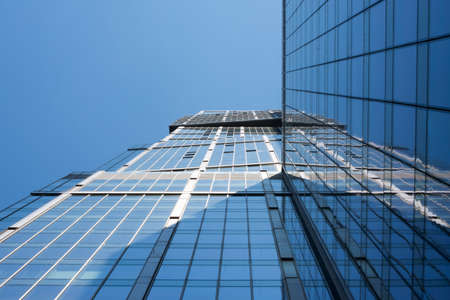 High-rise buildings on blue sky background, bottom viewの写真素材