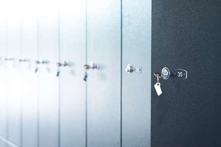 Metal lockers with keys, close up view