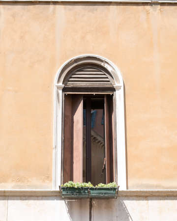Open window with flowers in house, bright dayの写真素材