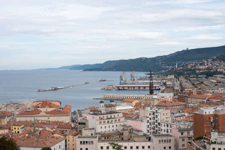 Top view of city with houses and seaの写真素材