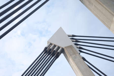 Steel construction on blue sky background with cloudsの写真素材