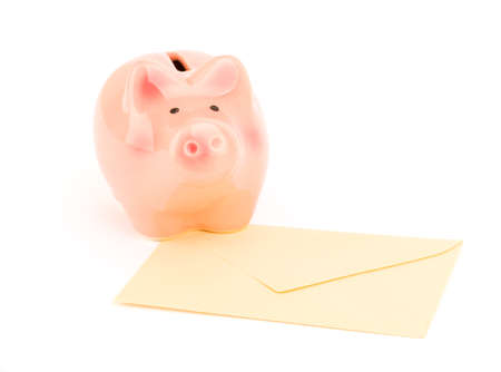 Small piggy bank envelope on isolated white background, close up viewの写真素材