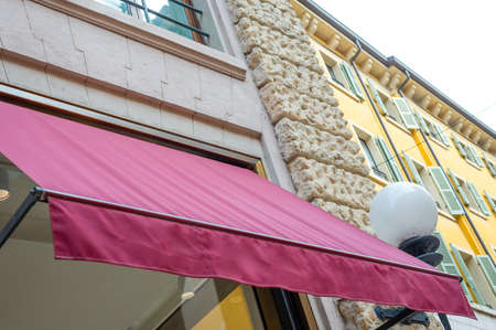 Old-fashioned building with street lamp on blue skyの写真素材