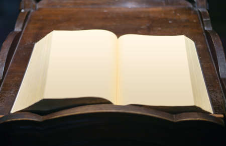 Open long book without text on wooden tableの写真素材