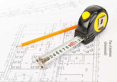 Tape measure with pencil on draft backgroundの写真素材