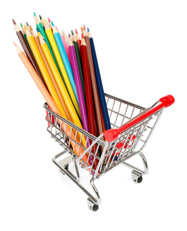 Crayons in shopping cart on isolated white backgroundの写真素材