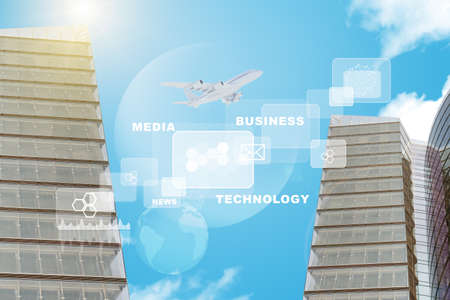 Buildings with world map and graphs on blue sky backgroundの写真素材