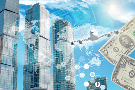 Building with world map and money on blue sky backgroundの写真素材